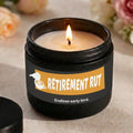 Candle in a black container with 'Retirement Rut' label on a light background